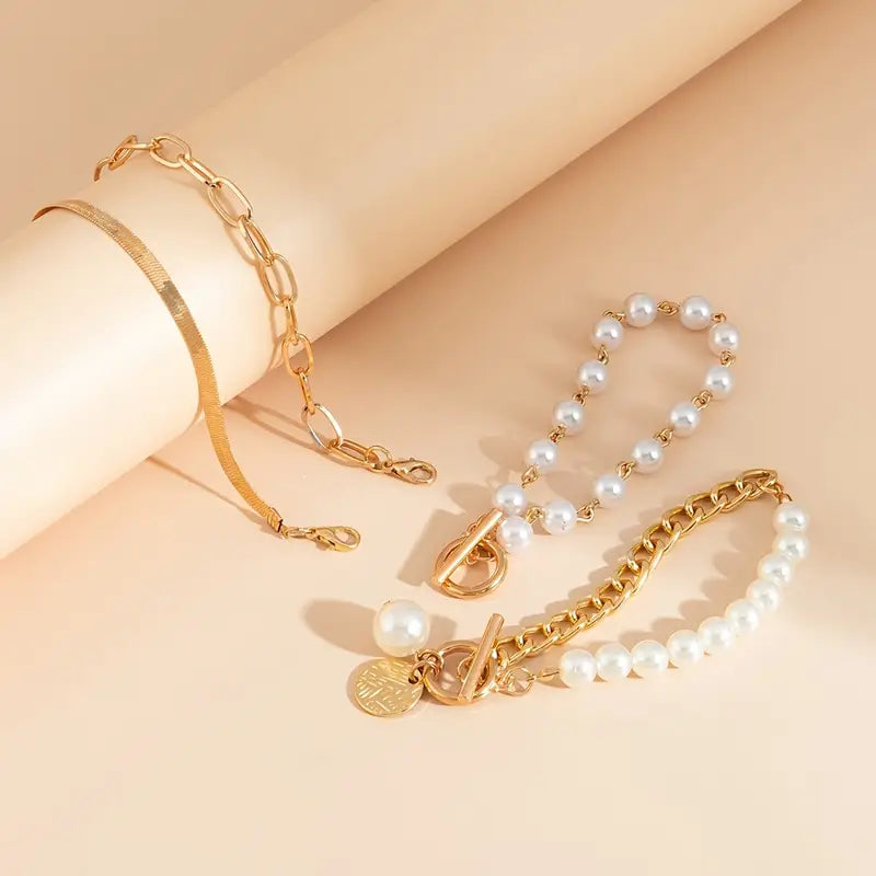 Set de 4 pulseras: serpiente, perlas y eslabones | Oro